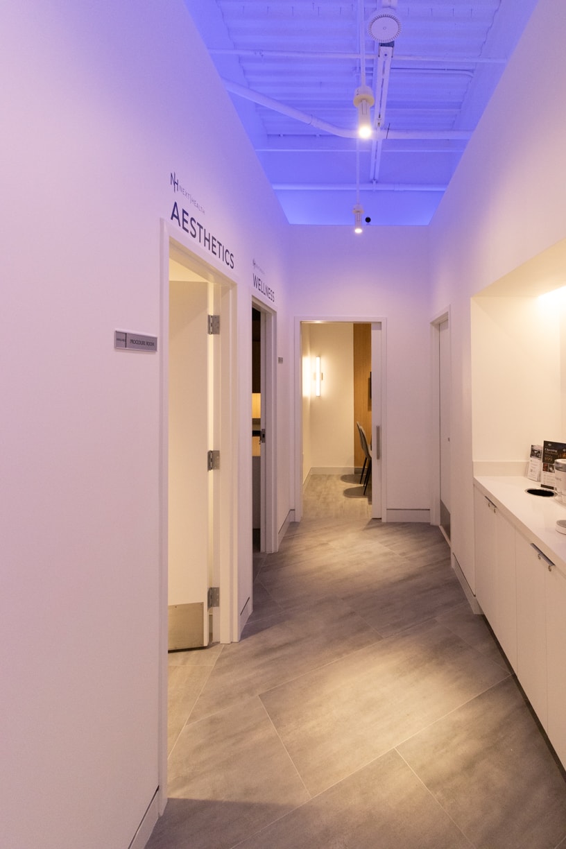 Next Health corridor with purple accent lighting
